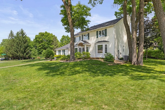 13870 Daphne Ln, Rosemount, MN 55068 - view of front of house featuring a chimney, a front yard, and central air condition unit