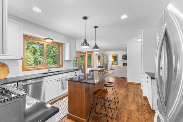 13870 Daphne Ln, Rosemount, MN 55068 - kitchen featuring stainless steel appliances, a sink, white cabinetry, a center island, and recessed lighting