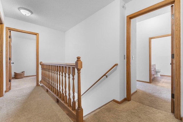 13870 Daphne Ln, Rosemount, MN 55068 - hallway featuring an upstairs landing, carpet flooring, and baseboards