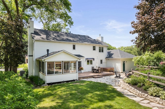 13870 Daphne Ln, Rosemount, MN 55068 - rear view of house featuring a chimney, a sunroom, central air condition unit, a deck, and a shingled roof