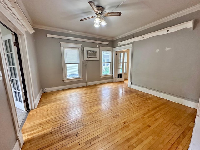506 Marshall St, Marshall, MN 56258 - spare room featuring ornamental molding, ceiling fan, a wall unit AC, light wood finished floors, and baseboards