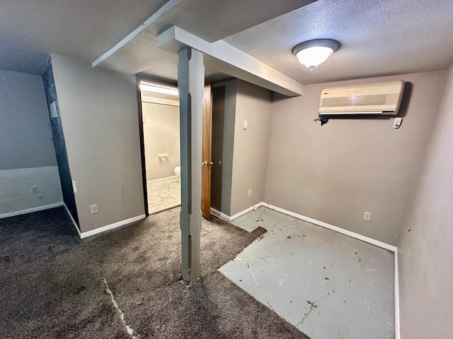 506 Marshall St, Marshall, MN 56258 - finished basement featuring a wall unit AC, a textured ceiling, and baseboards