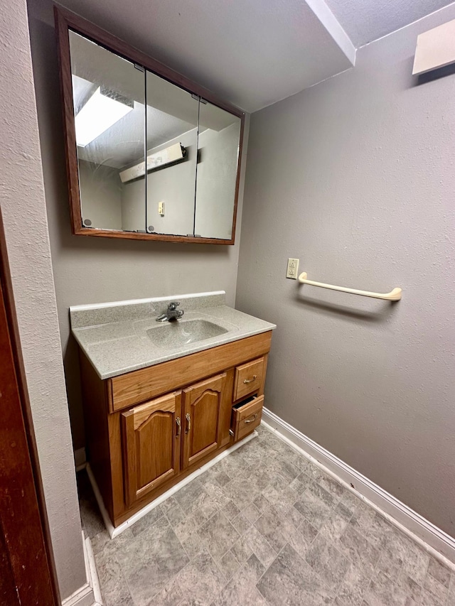 506 Marshall St, Marshall, MN 56258 - bathroom with baseboards and vanity