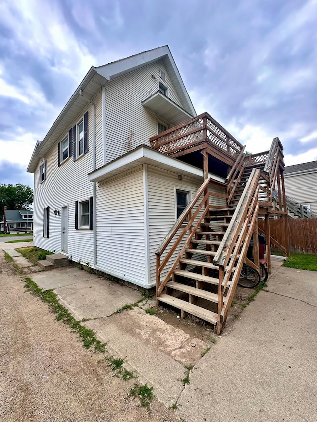 506 Marshall St, Marshall, MN 56258 - view of property exterior featuring a wooden deck and stairs