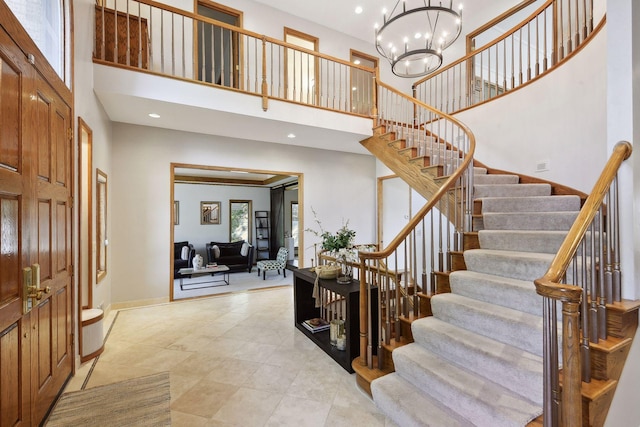 10481 Bluff Rd, Eden Prairie, MN 55347 - entrance foyer with a towering ceiling, stairway, a chandelier, recessed lighting, and light tile patterned flooring