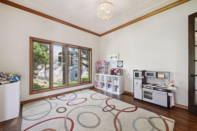 10481 Bluff Rd, Eden Prairie, MN 55347 - playroom featuring a chandelier, dark wood-style floors, and ornamental molding