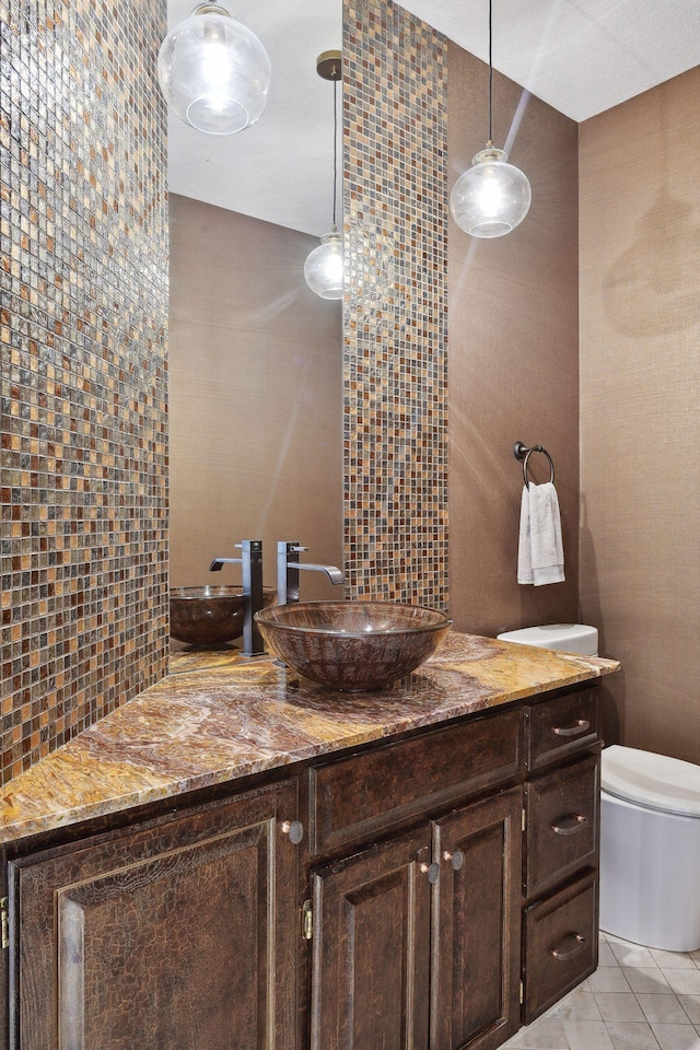 10481 Bluff Rd, Eden Prairie, MN 55347 - bathroom featuring vanity, decorative backsplash, tile patterned floors, and tile walls