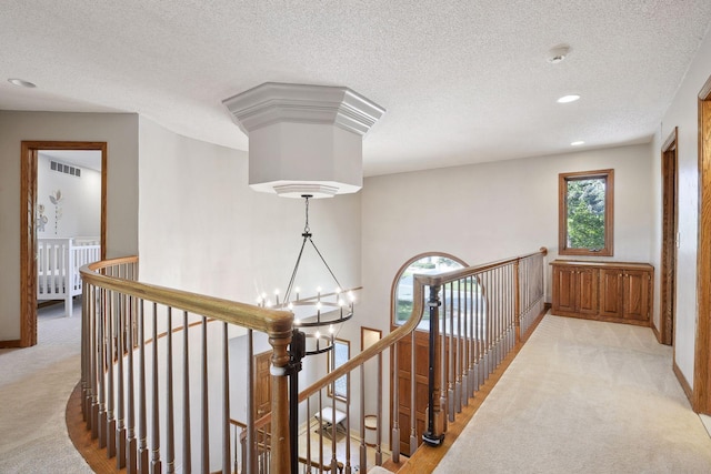 10481 Bluff Rd, Eden Prairie, MN 55347 - corridor with an upstairs landing, light colored carpet, a chandelier, a textured ceiling, and recessed lighting