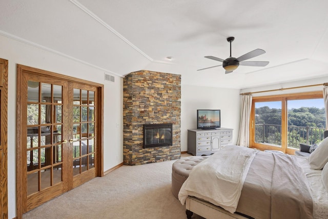 10481 Bluff Rd, Eden Prairie, MN 55347 - carpeted bedroom featuring access to exterior, crown molding, a stone fireplace, vaulted ceiling, and a ceiling fan