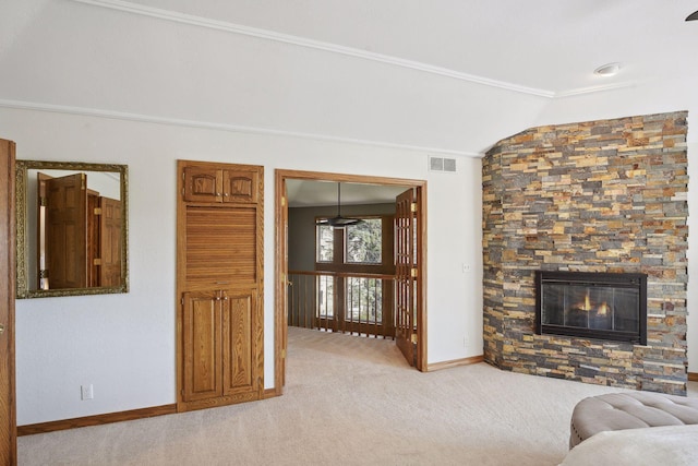 10481 Bluff Rd, Eden Prairie, MN 55347 - living room with lofted ceiling, ornamental molding, light carpet, and a stone fireplace
