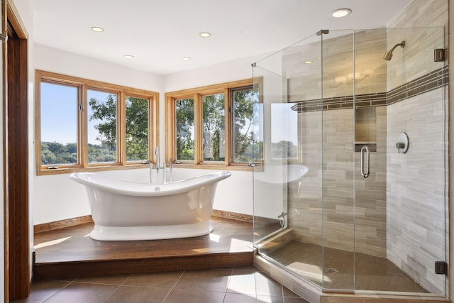 10481 Bluff Rd, Eden Prairie, MN 55347 - bathroom with tile patterned floors, recessed lighting, a freestanding tub, and a stall shower