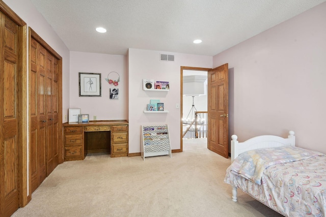10481 Bluff Rd, Eden Prairie, MN 55347 - bedroom featuring light carpet, recessed lighting, an office area, a closet, and a textured ceiling