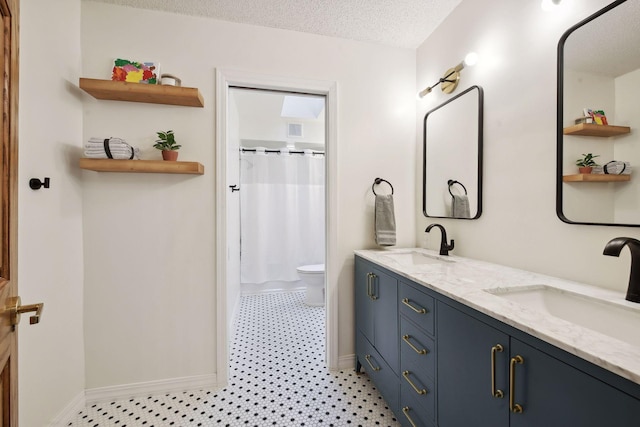10481 Bluff Rd, Eden Prairie, MN 55347 - bathroom with double vanity, curtained shower, a textured ceiling, and tile patterned floors