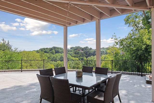 10481 Bluff Rd, Eden Prairie, MN 55347 - view of patio / terrace featuring a forest view and outdoor dining space