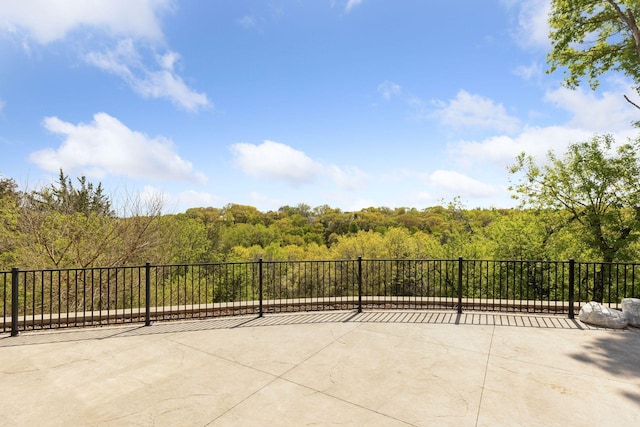 10481 Bluff Rd, Eden Prairie, MN 55347 - view of patio / terrace featuring a wooded view