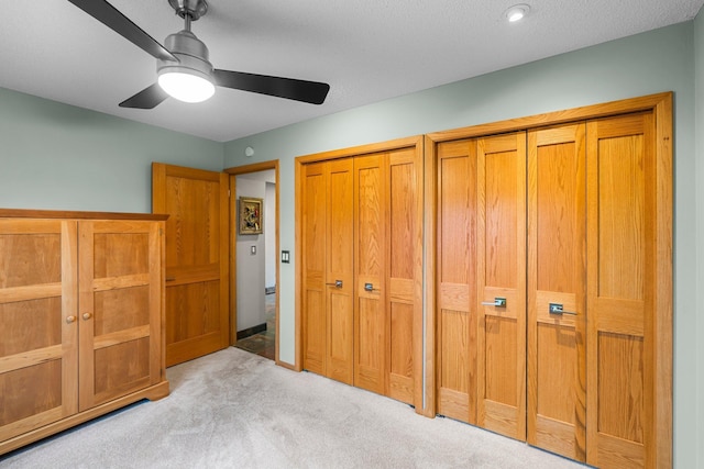 8440 Delaney Ct, Inver Grove Heights, MN 55076 - unfurnished bedroom featuring carpet, two closets, and ceiling fan