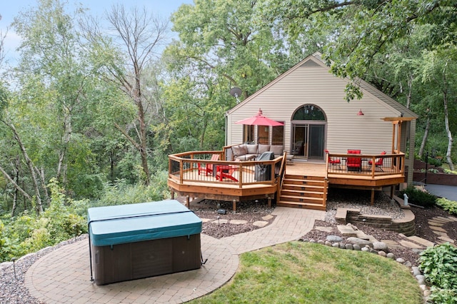 8440 Delaney Ct, Inver Grove Heights, MN 55076 - rear view of house featuring a hot tub, a wooden deck, and an outdoor hangout area