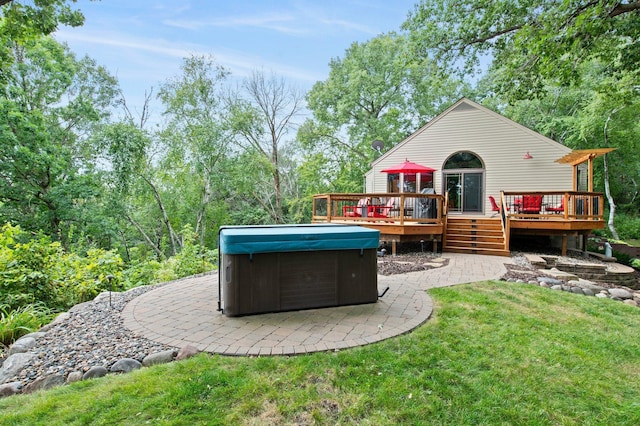 8440 Delaney Ct, Inver Grove Heights, MN 55076 - rear view of house with a hot tub, a wooden deck, a patio area, and a yard