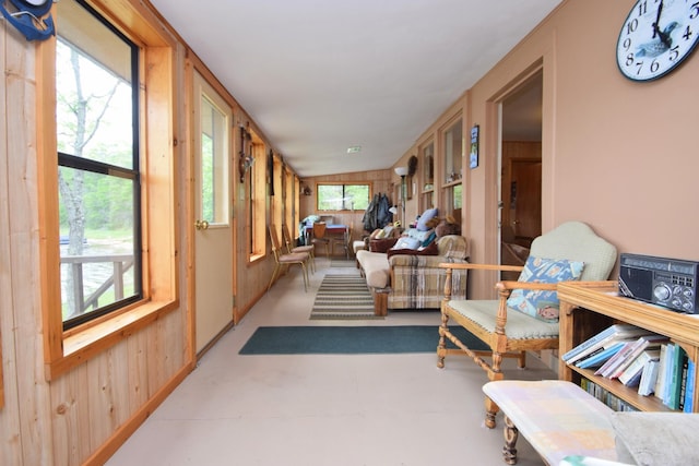 3777 Deer Lake Dr, Danbury, WI 54830 - sunroom featuring plenty of natural light, wooden walls, and concrete floors