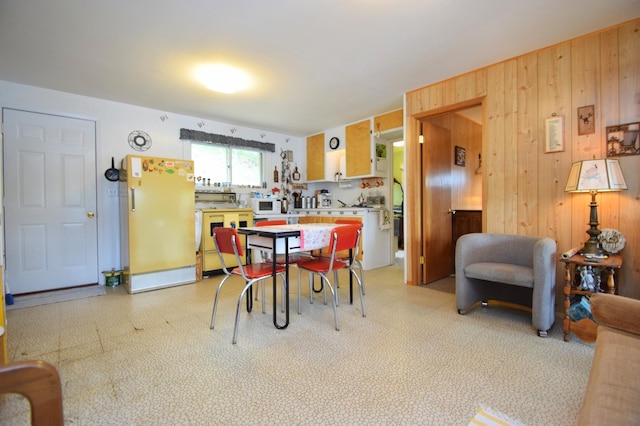 3777 Deer Lake Dr, Danbury, WI 54830 - dining room featuring light floors and wooden walls