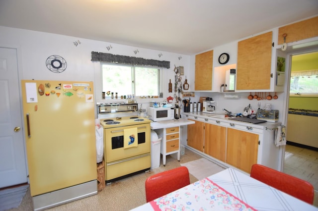 3777 Deer Lake Dr, Danbury, WI 54830 - kitchen with white appliances, plenty of natural light, light countertops, and light floors