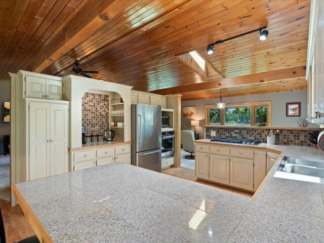 15473 Wilderness Trl, Crosslake, MN 56442 - kitchen featuring stainless steel appliances, a peninsula, tasteful backsplash, wood ceiling, and ceiling fan