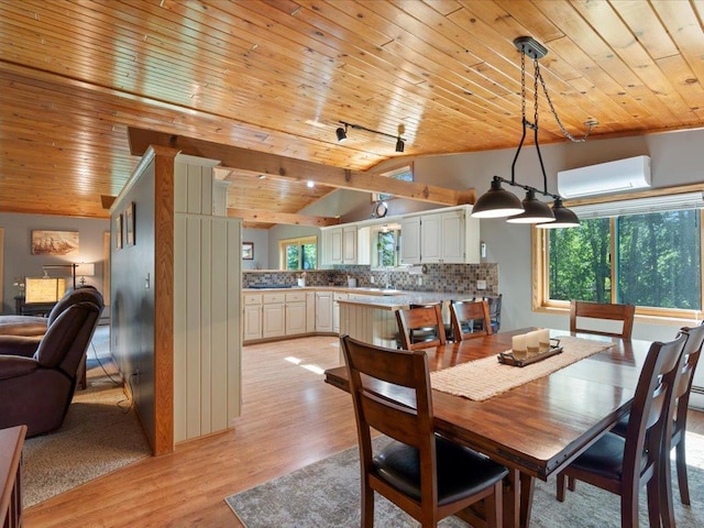 15473 Wilderness Trl, Crosslake, MN 56442 - dining room with lofted ceiling, wooden ceiling, a wall mounted air conditioner, plenty of natural light, and light wood-type flooring
