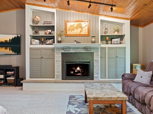 15473 Wilderness Trl, Crosslake, MN 56442 - living room with wood ceiling, lofted ceiling, built in shelves, a fireplace, and carpet floors