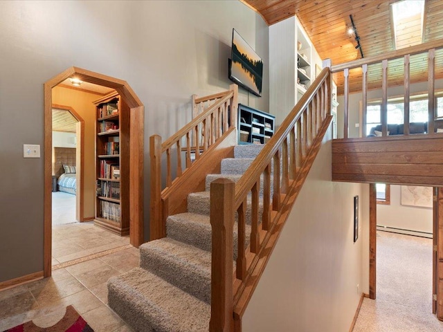 15473 Wilderness Trl, Crosslake, MN 56442 - stairway with a baseboard heating unit and wood ceiling