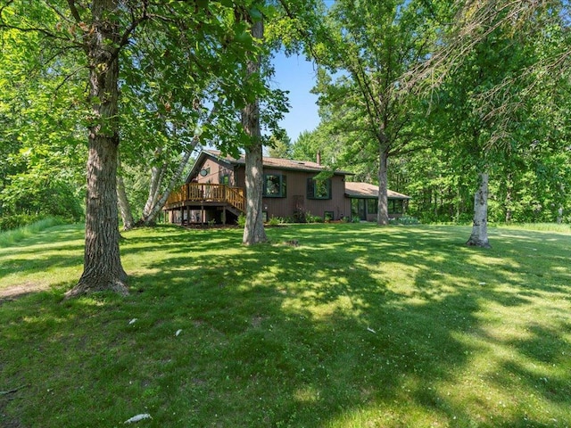 15473 Wilderness Trl, Crosslake, MN 56442 - view of grassy yard featuring a wooden deck