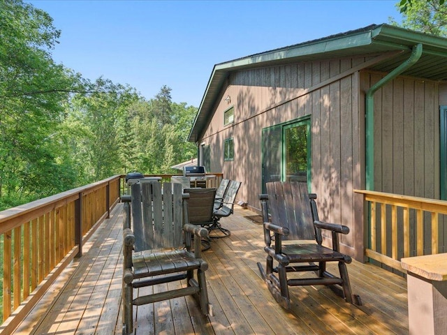 15473 Wilderness Trl, Crosslake, MN 56442 - wooden terrace featuring outdoor dining space and area for grilling