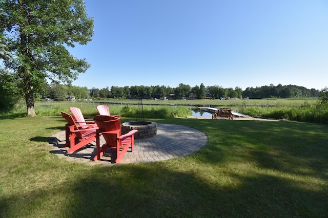 15473 Wilderness Trl, Crosslake, MN 56442 - view of grassy yard with a fire pit