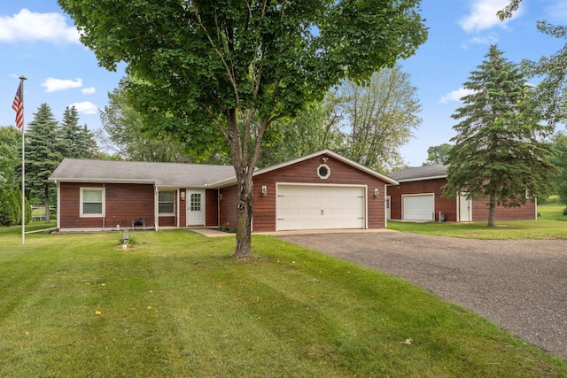 9351 Ermine Blvd NW, Ramsey, MN 55303 - ranch-style home featuring an attached garage, a front yard, and driveway