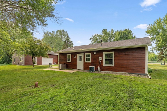 9351 Ermine Blvd NW, Ramsey, MN 55303 - rear view of property with a lawn, a patio area, and an outdoor structure