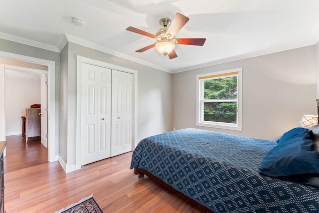 9351 Ermine Blvd NW, Ramsey, MN 55303 - bedroom featuring wood finished floors, a closet, ceiling fan, and ornamental molding