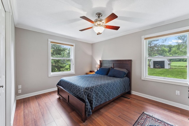 9351 Ermine Blvd NW, Ramsey, MN 55303 - bedroom with ornamental molding, wood finished floors, and ceiling fan