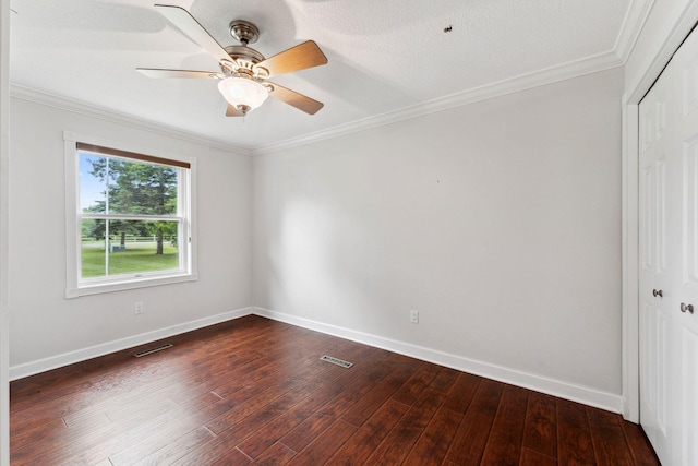 9351 Ermine Blvd NW, Ramsey, MN 55303 - spare room featuring dark wood finished floors, ornamental molding, and ceiling fan