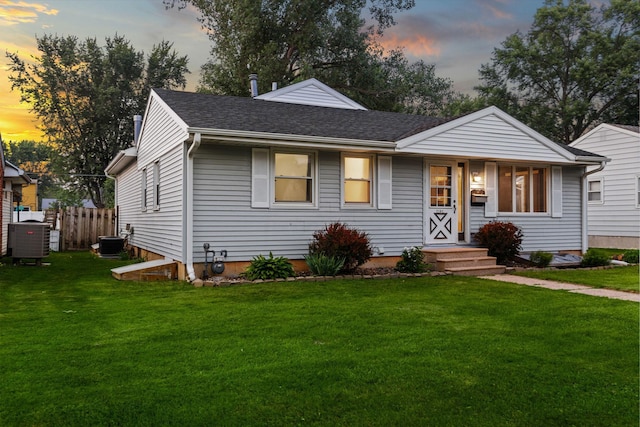 2101 6th Ave NE, Austin, MN 55912 - view of front of house with central AC unit and a shingled roof