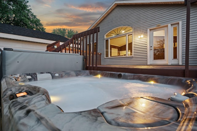 2101 6th Ave NE, Austin, MN 55912 - property exterior at dusk with a fire pit