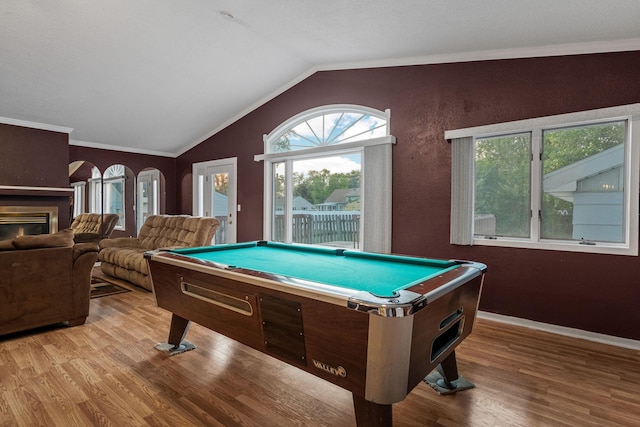2101 6th Ave NE, Austin, MN 55912 - game room with billiards table, wood finished floors, lofted ceiling, ornamental molding, and baseboards