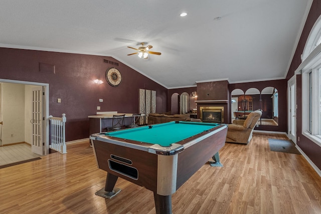 2101 6th Ave NE, Austin, MN 55912 - recreation room with light wood-style floors, vaulted ceiling, baseboards, ceiling fan, and billiards table