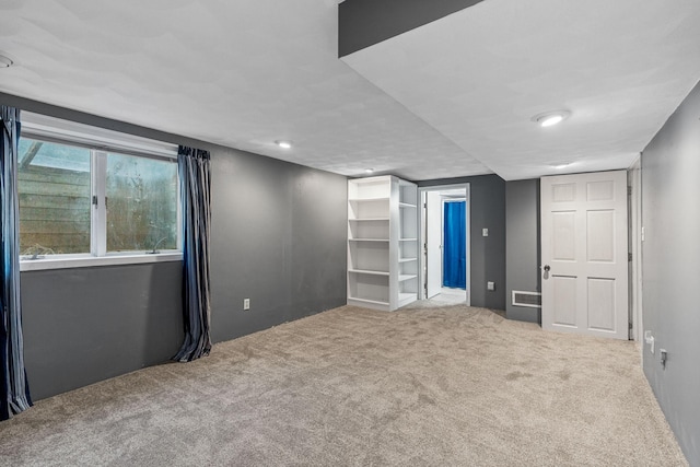 2101 6th Ave NE, Austin, MN 55912 - unfurnished bedroom with carpet flooring