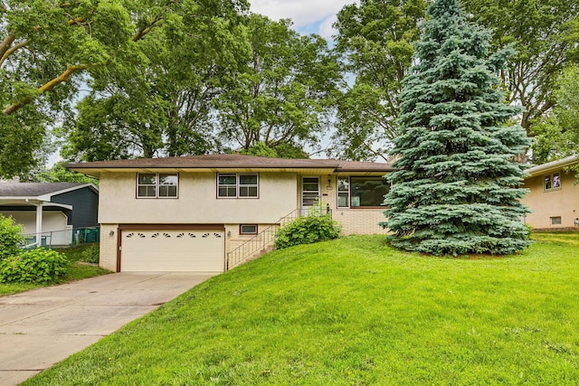 3101 Hilldale Ave NE, Saint Anthony, MN 55418 - view of front of property with a garage, brick siding, concrete driveway, a front lawn, and stucco siding