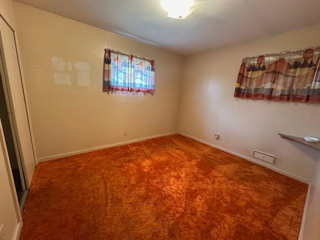 21 Glen Cir, Babbitt, MN 55706 - unfurnished room featuring carpet flooring and baseboards