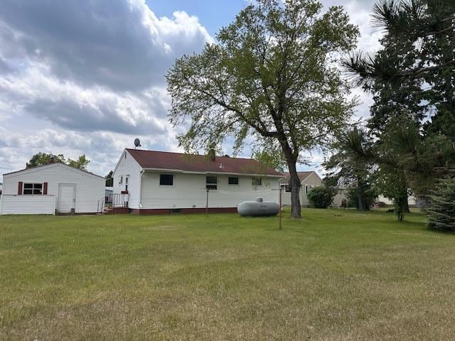 21 Glen Cir, Babbitt, MN 55706 - rear view of property featuring a lawn