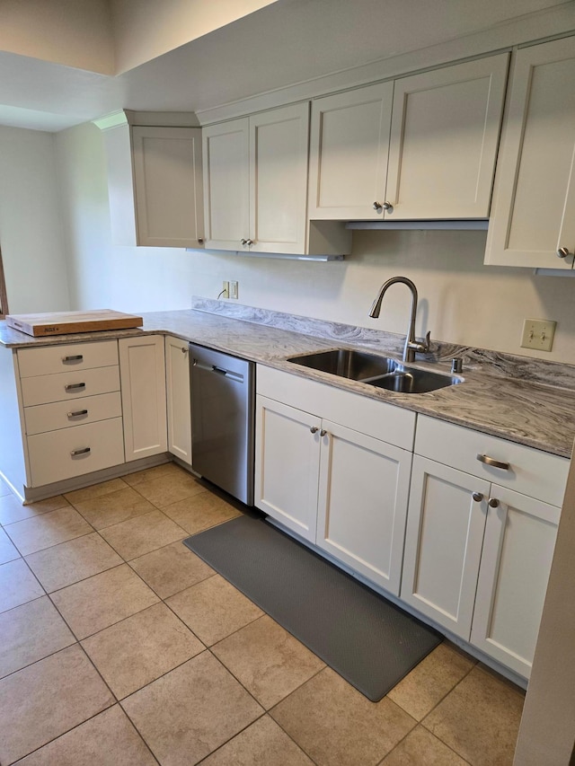 1924 Greenfield Ln SW Unit 201, Rochester, MN 55902 - kitchen with stainless steel dishwasher, a sink, light tile patterned flooring, light countertops, and white cabinetry
