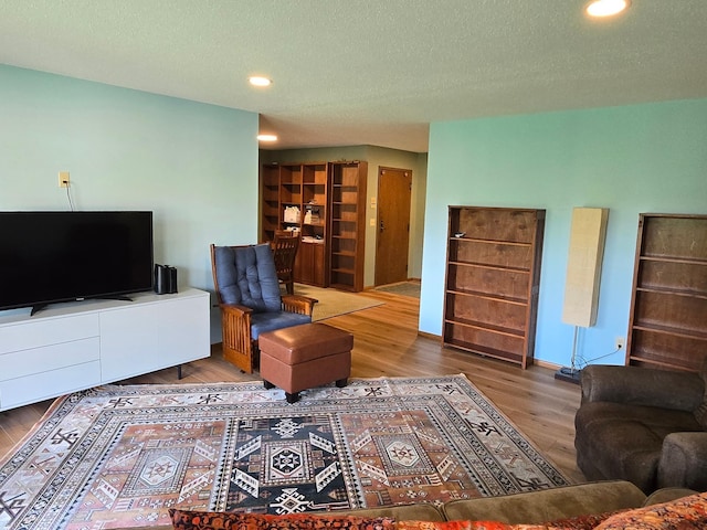 1924 Greenfield Ln SW Unit 201, Rochester, MN 55902 - living room featuring wood finished floors, recessed lighting, a textured ceiling, and baseboards