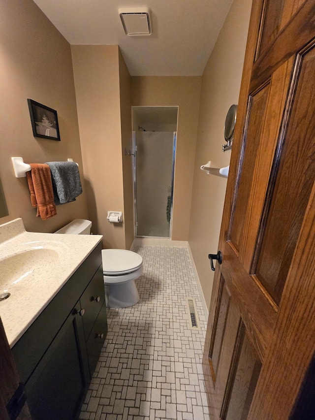 1924 Greenfield Ln SW Unit 201, Rochester, MN 55902 - full bathroom featuring a stall shower, vanity, and toilet