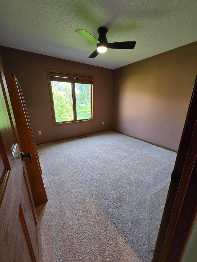 1924 Greenfield Ln SW Unit 201, Rochester, MN 55902 - carpeted spare room featuring a ceiling fan and a textured ceiling