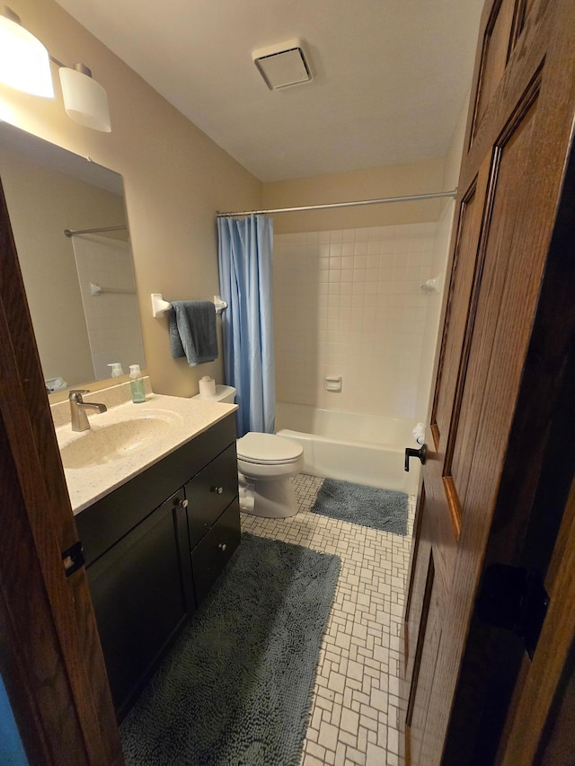 1924 Greenfield Ln SW Unit 201, Rochester, MN 55902 - bathroom featuring vanity, shower / bathtub combination with curtain, and toilet